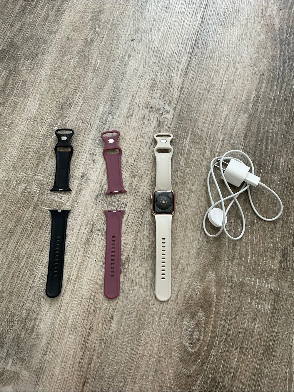 Apple Smartwatch with White, Black, and Mauve Bands